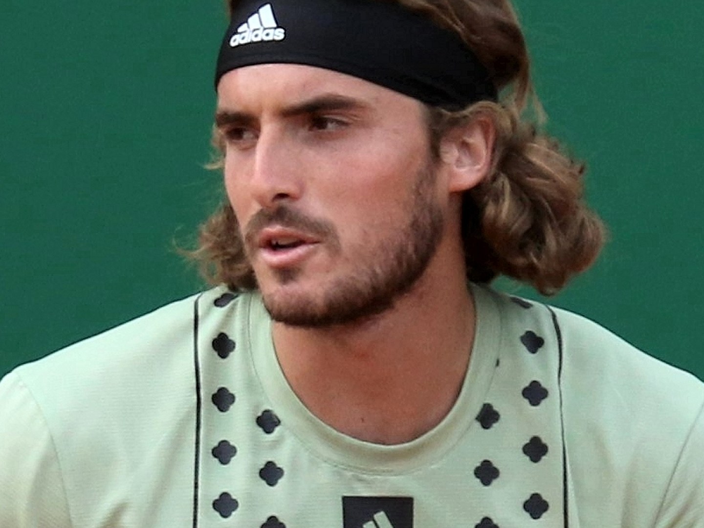 Stefanos Tsitsipas playing tennis